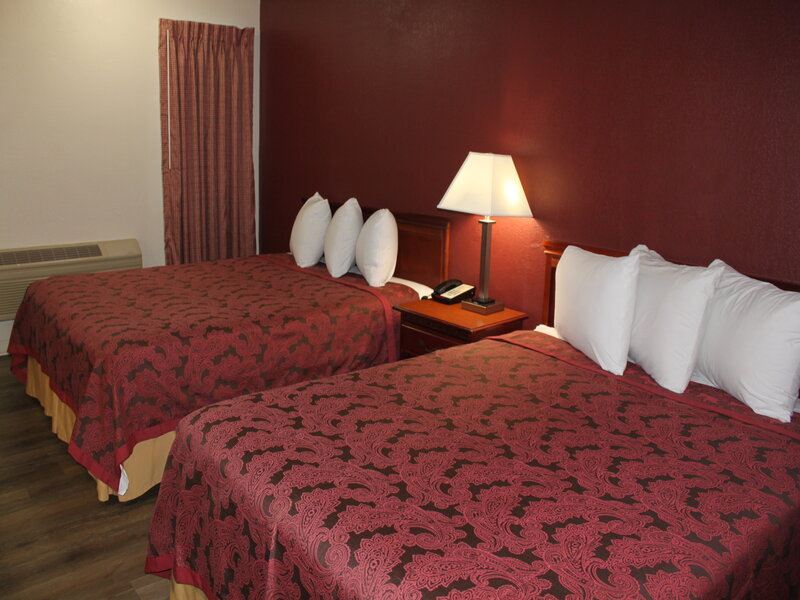View of a room with two queen beds at the Travel Inn of Buford
