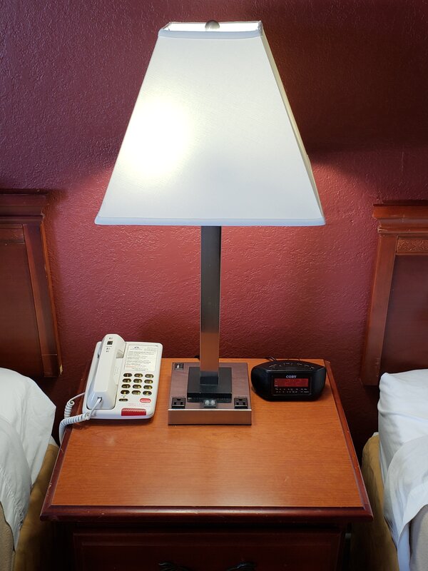 Nightstand and Lamp at the Travel Inn in Buford GA